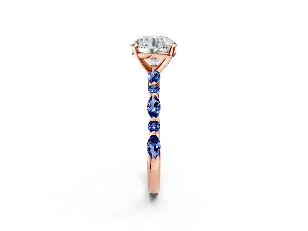 Round Cut Diamond Ring with Marquise and Round Blue Sapphire Side Stones and Four-Prong Setting Rose gold