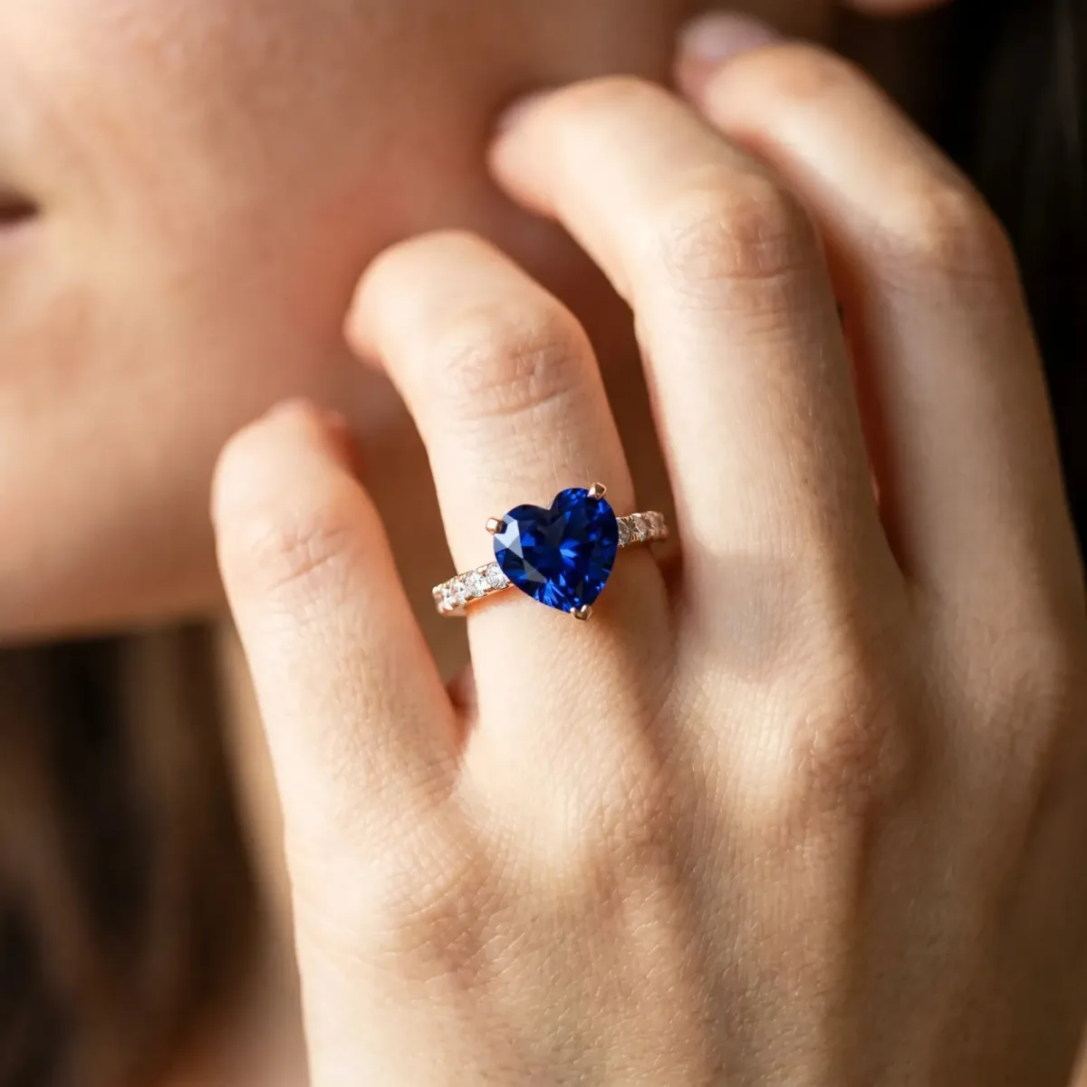 Heart Cut Blue Sapphire Solitaire Ring with Round Pavé Band and Four-Prong Setting Rose gold