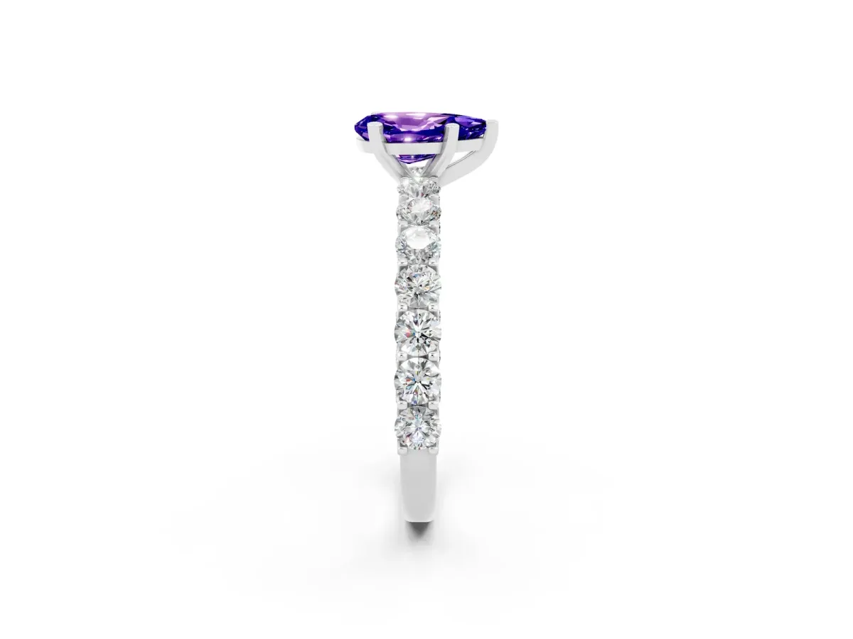 Pear Cut Tanzanite Solitaire Ring with Shared Prong Pavé Band and Four-Prong Setting Silver