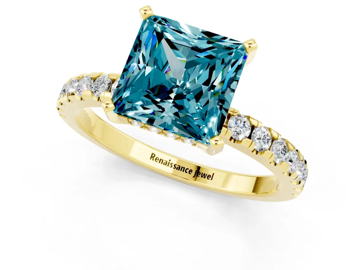 Princess Cut Blue Topaz Solitaire Ring with Round Pavé Band and Four-Prong Setting Yellow gold