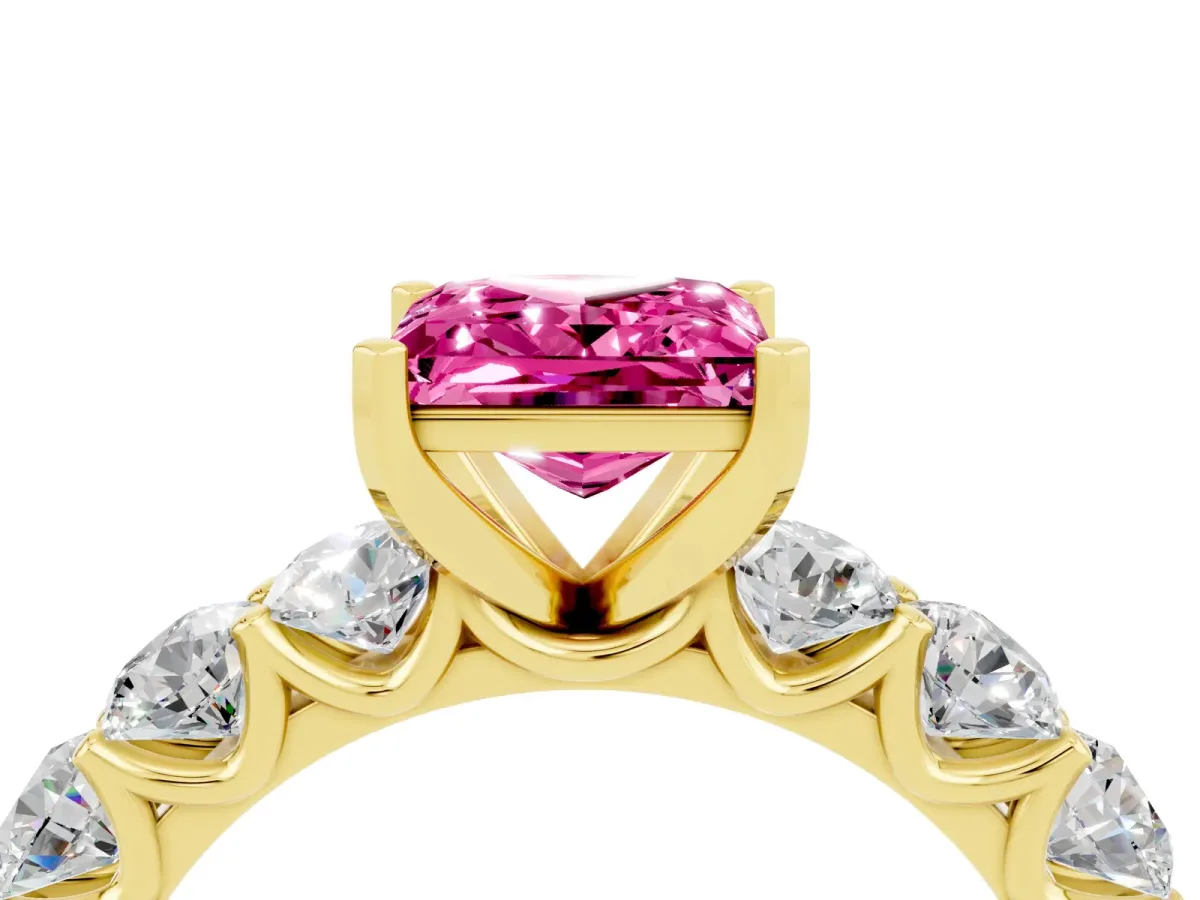 Princess Cut Pink Sapphire Prong Setting with Side Stones on a Pave Band Yellow gold