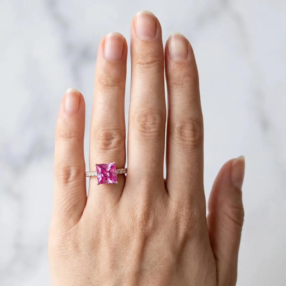 Princess Cut Pink Sapphire Solitaire Ring with Round Pavé Band and Four-Prong Setting Rose gold