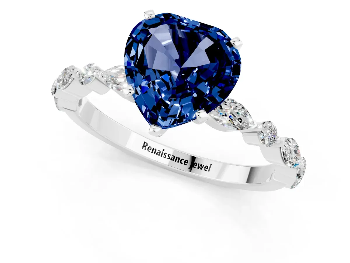 Heart Cut Blue Sapphire Ring with Marquise and Round Side Stones and Four-Prong Setting White gold