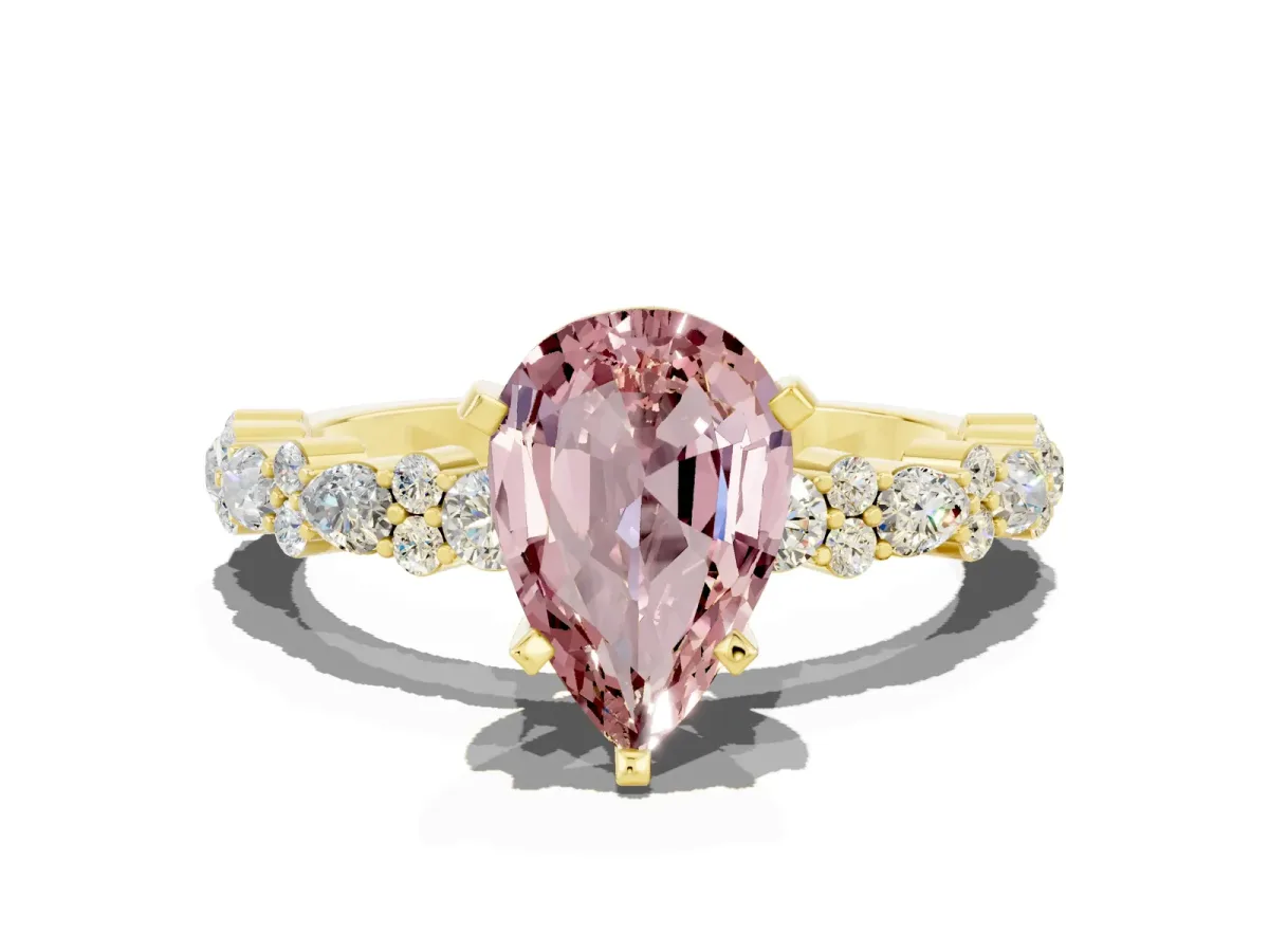 Pear Cut Morganite Side Stone Solitaire Ring with Round and Four-Prong Setting Yellow gold