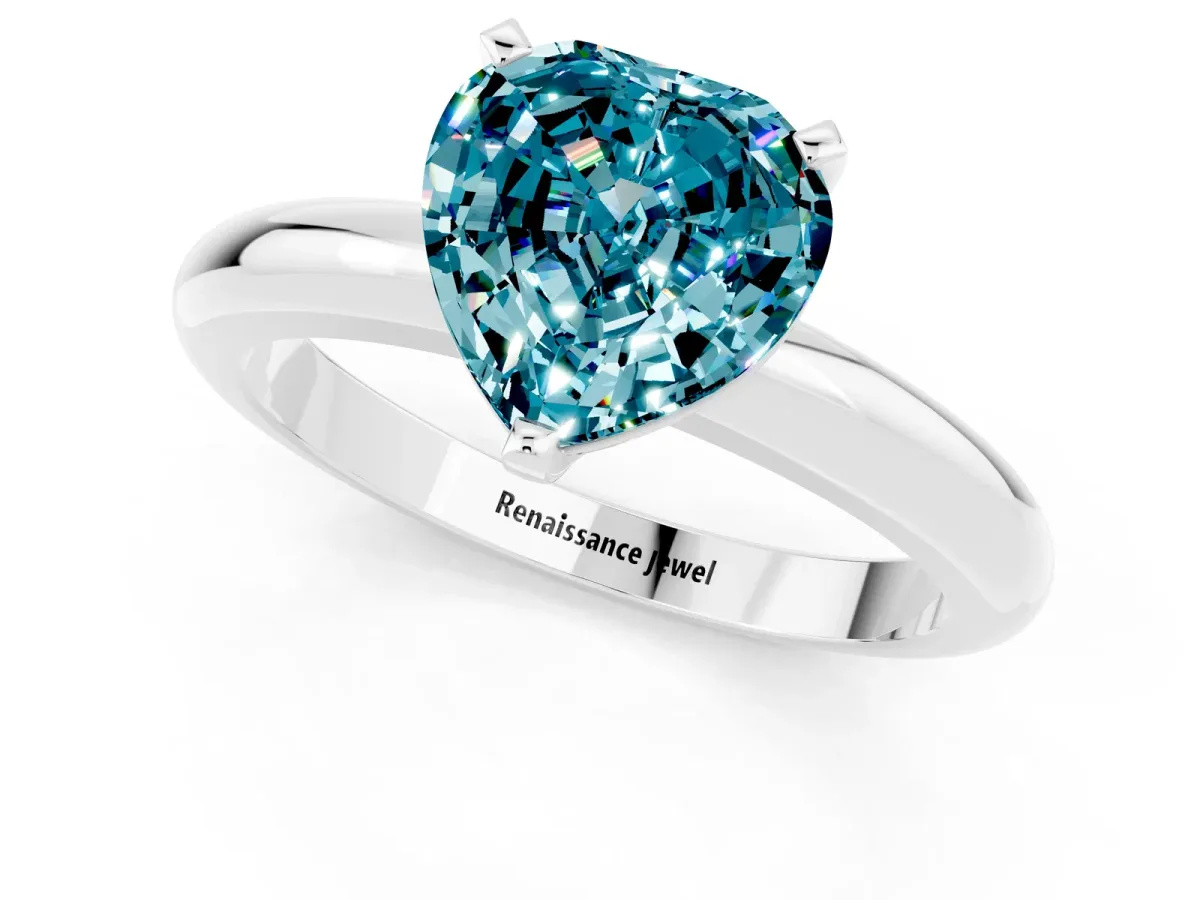 Heart Cut Blue Topaz Solitaire Engagement Ring with Round Band and Four-Prong Setting White gold
