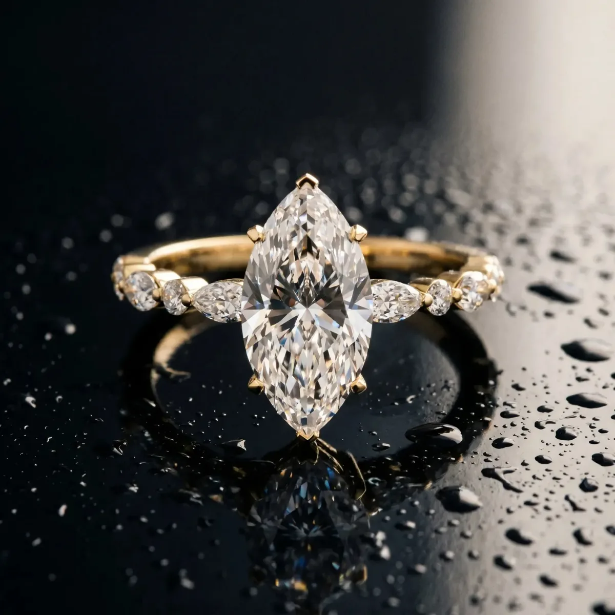 Marquise Cut Diamond Ring with Marquise and Round Side Stones and Four-Prong Setting Yellow gold