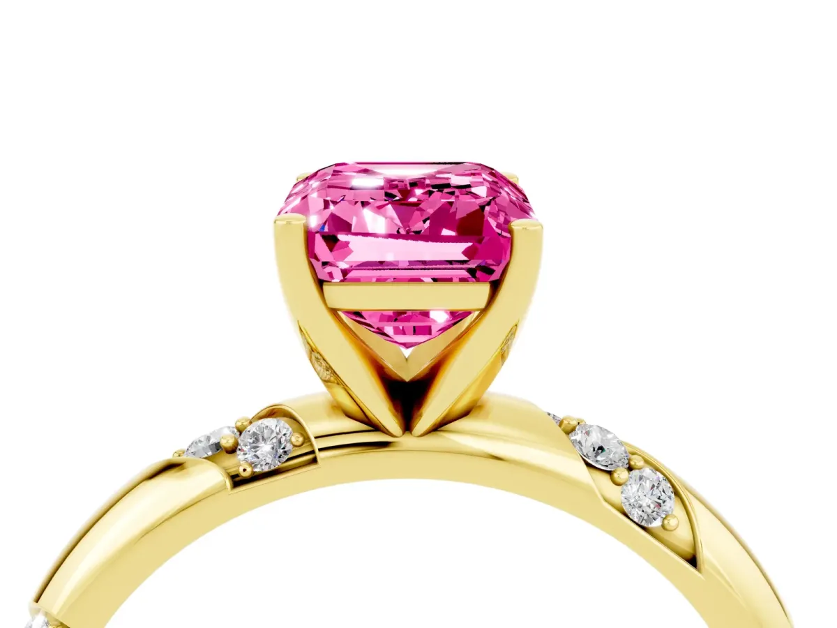 Emerald Cut Pink Sapphire Solitaire Engagement Ring with Twisted Round Accent Band and Prong Setting Yellow gold