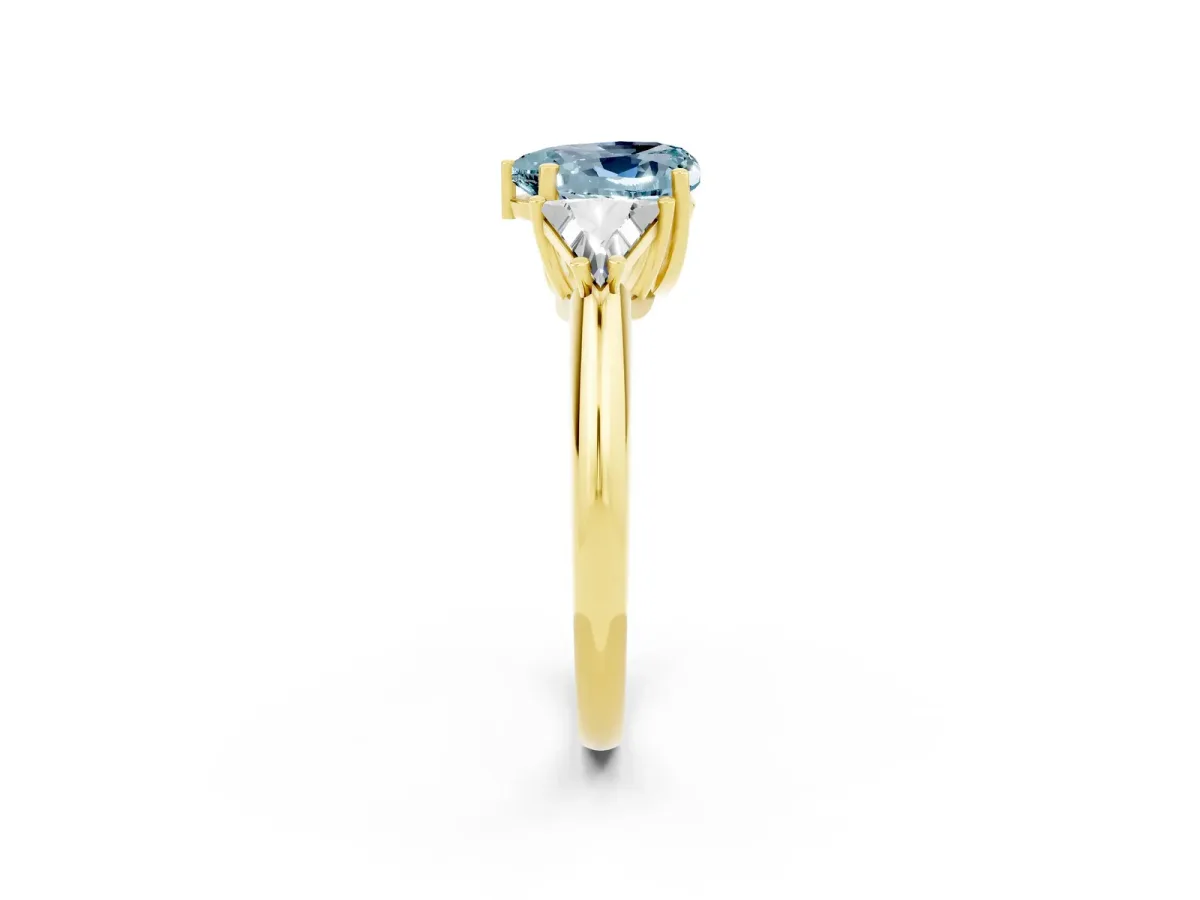 Three-Stone Heart Cut Aquamarine Engagement Ring with Trillion Side Stones and Prong Setting Yellow gold