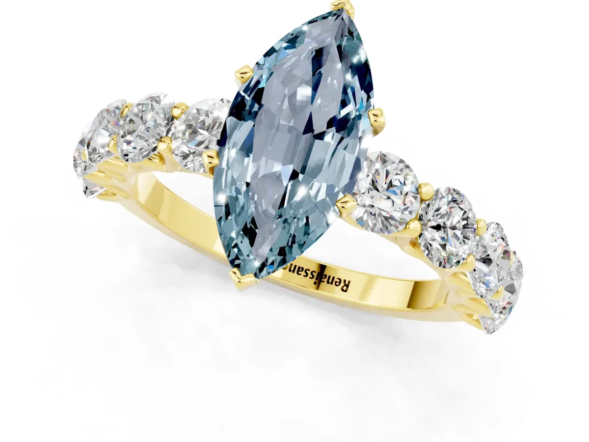 Marquise Cut Aquamarine Prong Setting with Side Stones on a Pave Band Yellow gold
