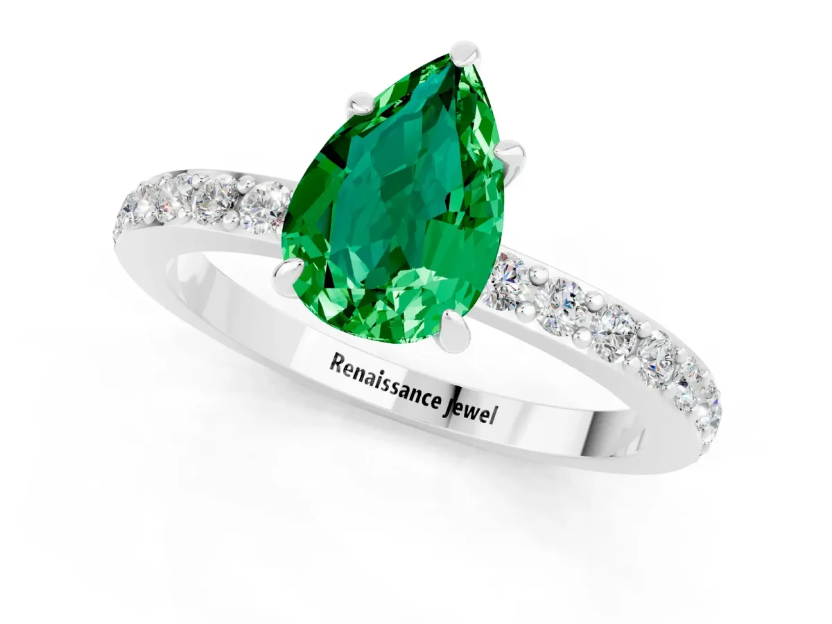 Pear Cut Emerald Solitaire Engagement Ring with Pavé Band and Four-Prong Setting Silver