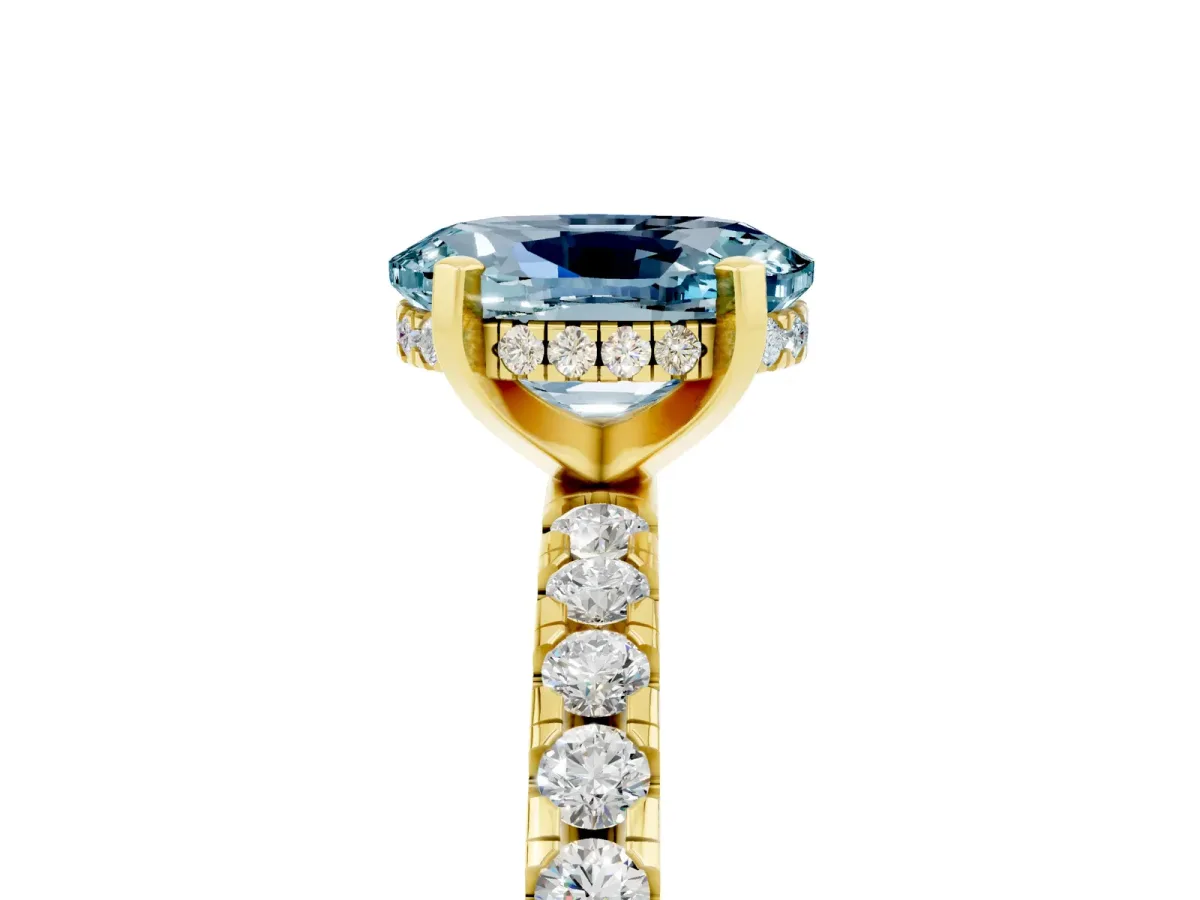 Oval Cut Aquamarine Solitaire Ring with Round Pavé Band and Four-Prong Setting Yellow gold
