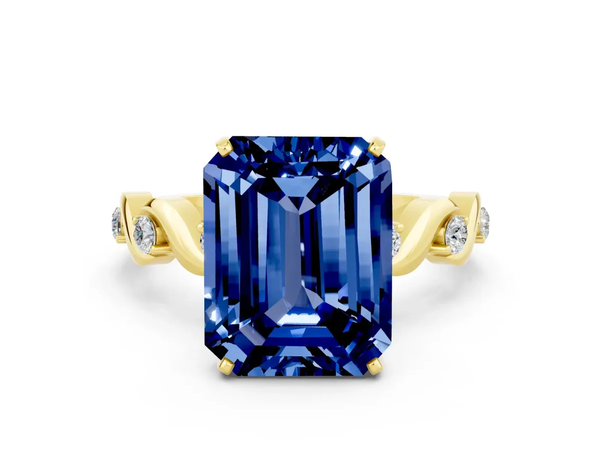 Emerald Cut Blue Sapphire Solitaire Twisted Band with Round Accents and Prong Setting Yellow gold
