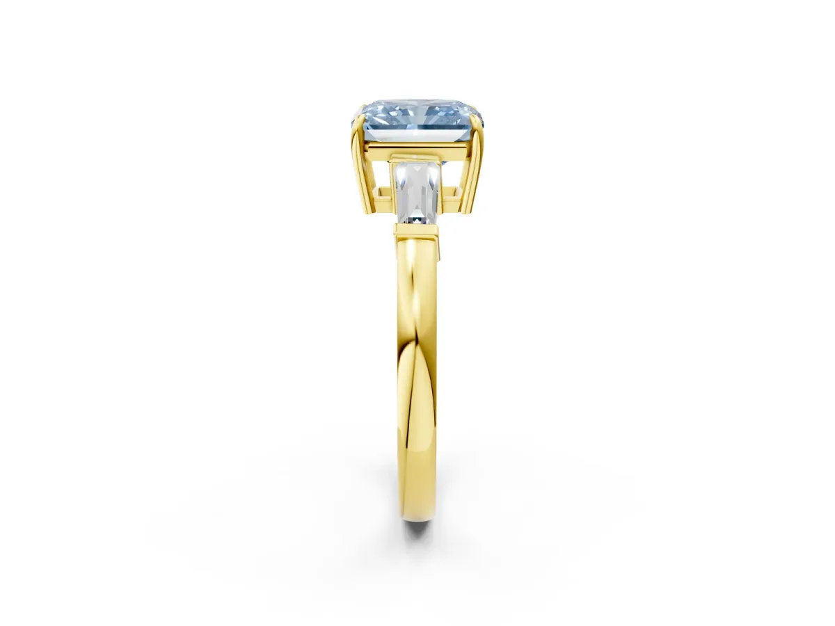 Fancy Blue Radiant Cut Diamond Three-Stone Ring with Tapered Baguette Side Stones and Prong Setting Yellow gold