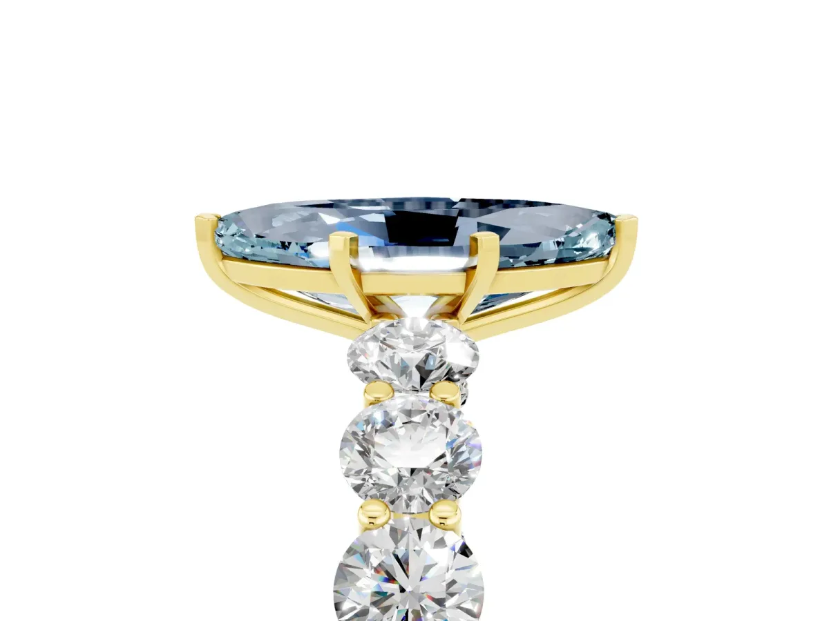 Marquise Cut Aquamarine Prong Setting with Side Stones on a Pave Band Yellow gold