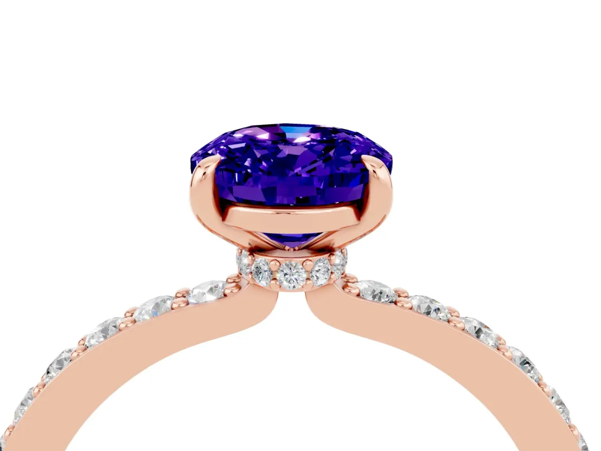 Oval Cut Tanzanite Solitaire Engagement Ring with Pavé Band and Four-Prong Setting Rose gold