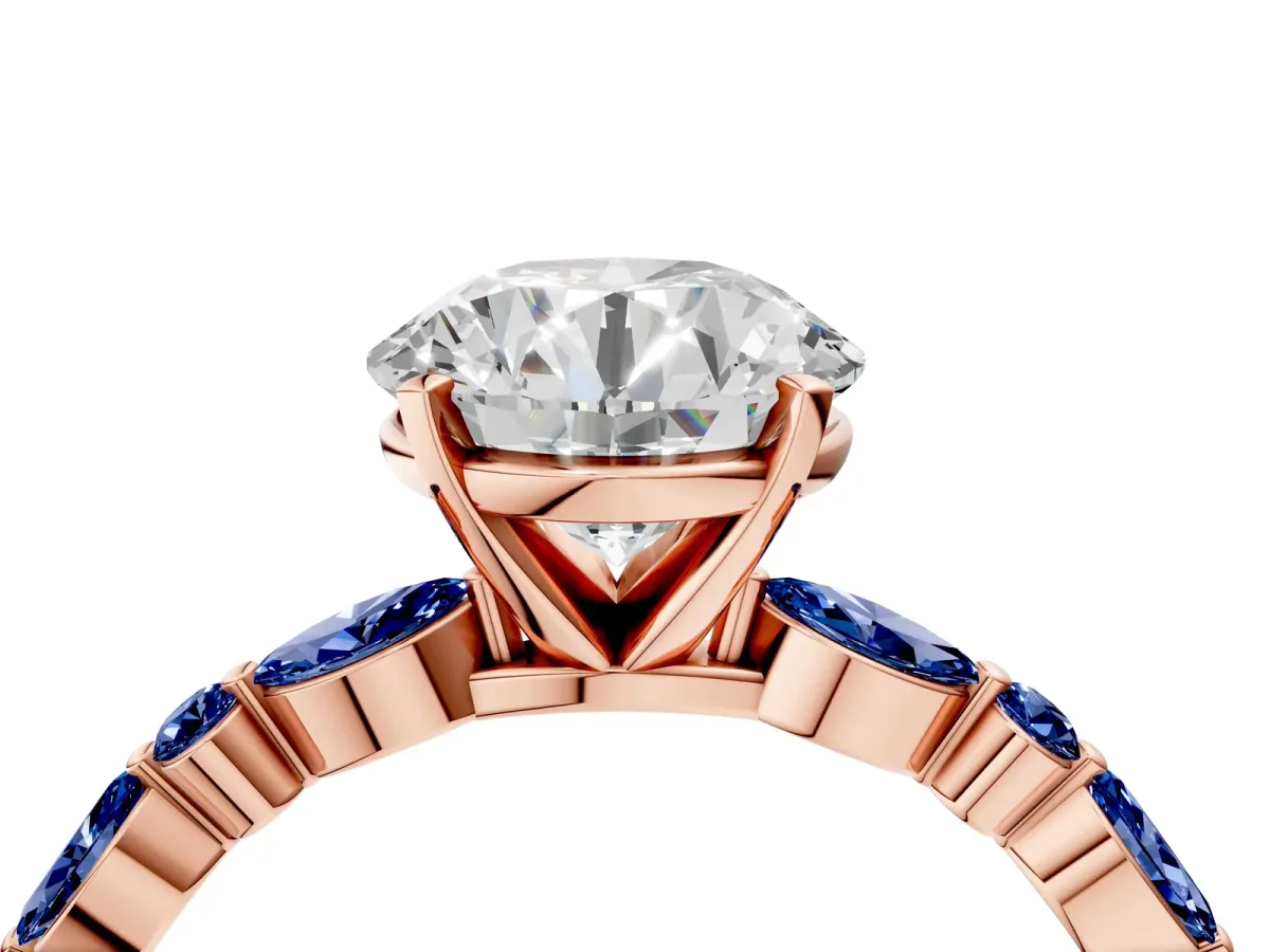 Round Cut Diamond Ring with Marquise and Round Blue Sapphire Side Stones and Four-Prong Setting Rose gold