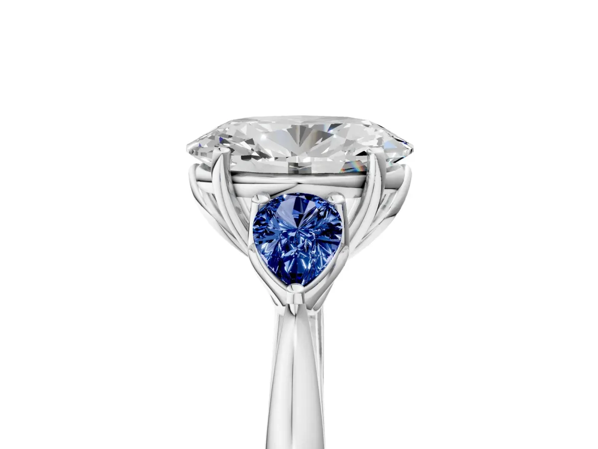 Oval Cut Diamond Three-Stone Ring with Pear Blue Sapphire Side Stones and Prong Setting Silver