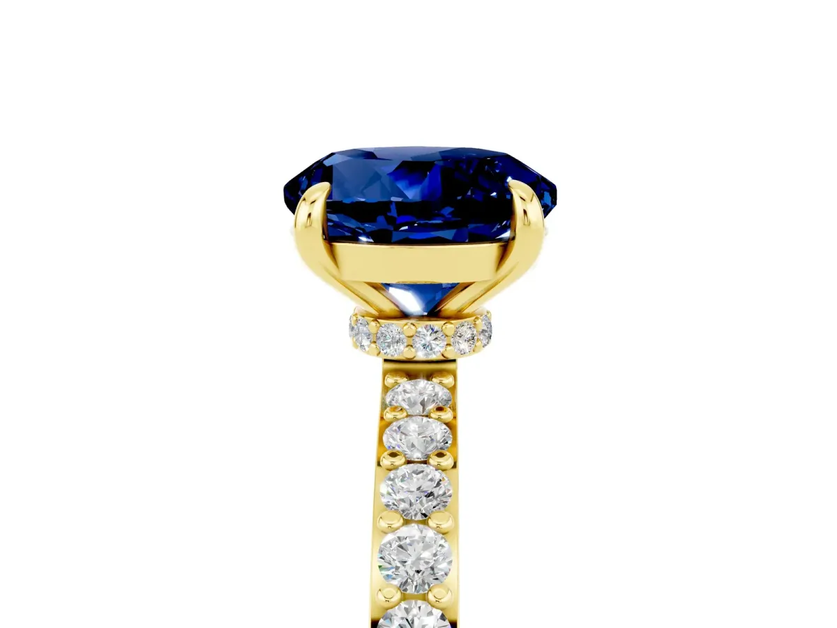 Round Cut Blue Sapphire Solitaire Engagement Ring with Pavé Band and Four-Prong Setting Yellow gold