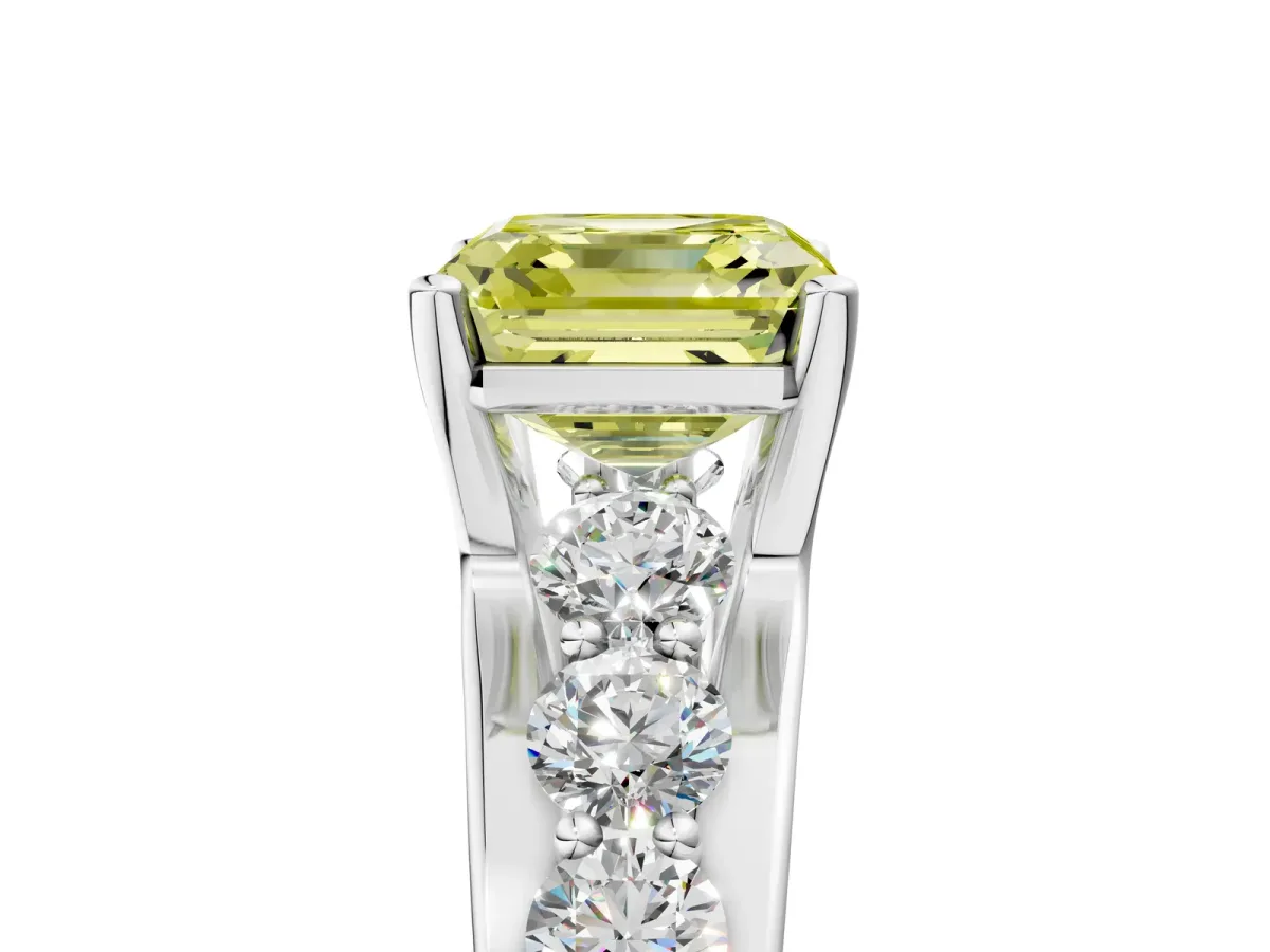 Fancy Yellow Asscher Cut Brilliant Solitaire with Side Stones on a Pave Band and Four-Prong Setting Platinum