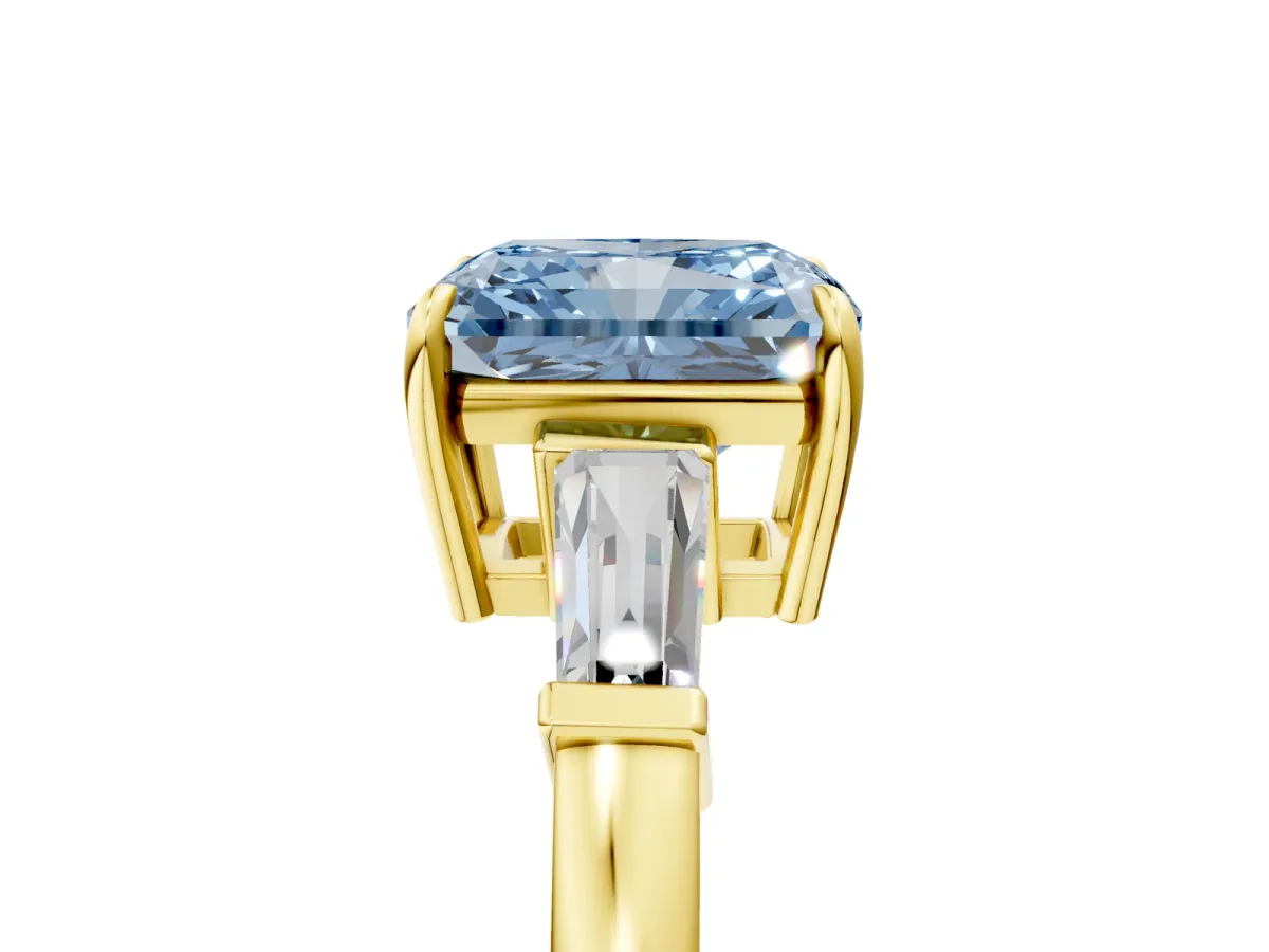 Fancy Blue Radiant Cut Diamond Three-Stone Ring with Tapered Baguette Side Stones and Prong Setting Yellow gold