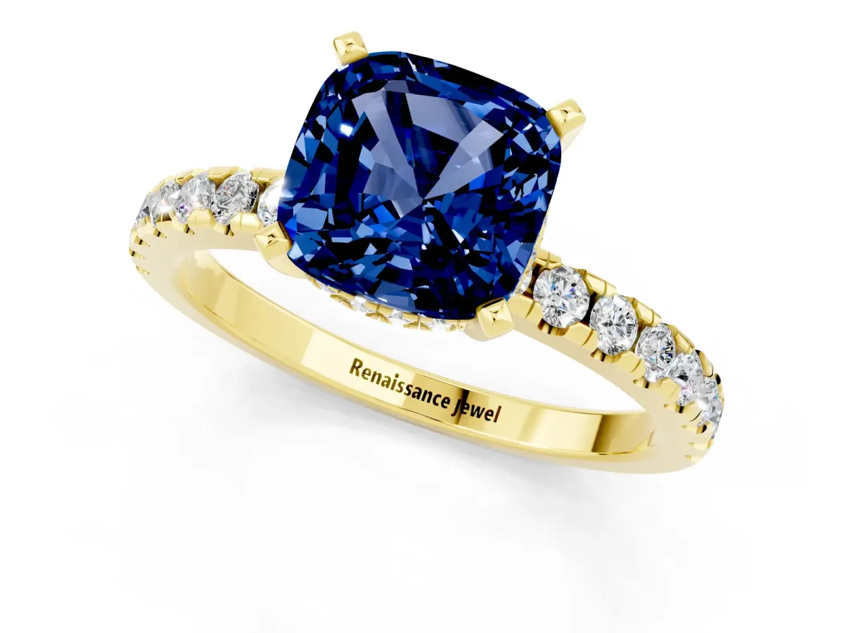 Cushion Cut Blue Sapphire Solitaire Ring with Round Pavé Band and Four-Prong Setting Yellow gold
