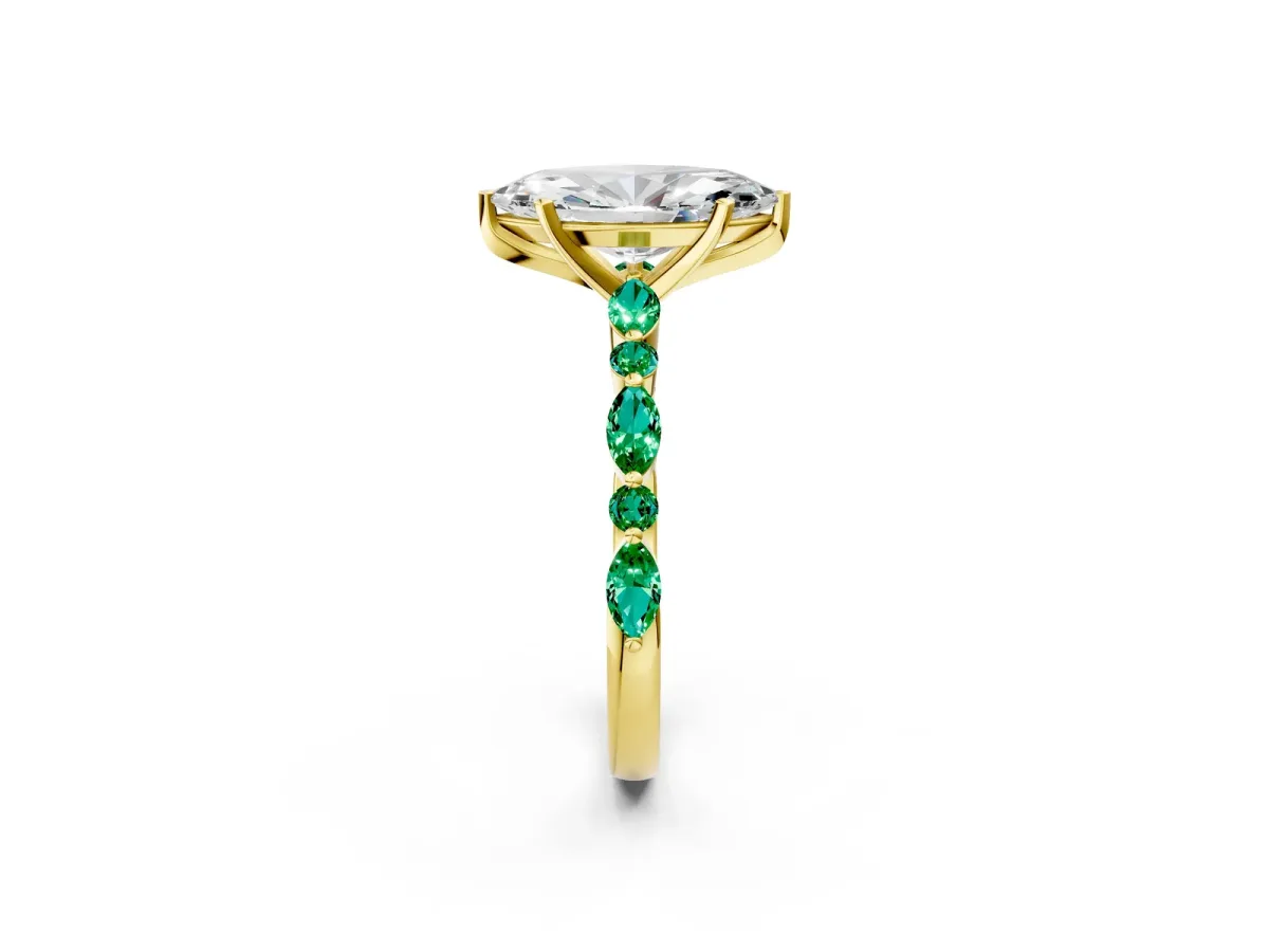 Marquise Cut Diamond Ring with Marquise and Round Emerald Side Stones and Four-Prong Setting Yellow gold