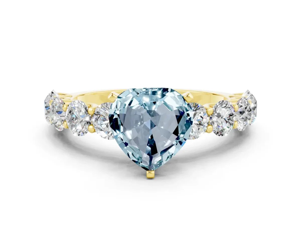 Heart Cut Aquamarine Prong Setting with Side Stones on a Pave Band Yellow gold
