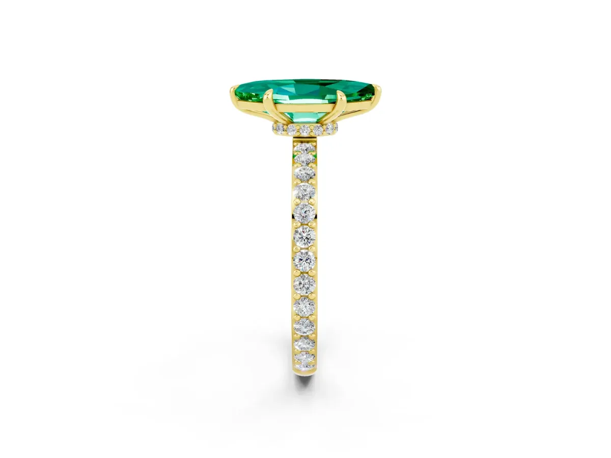 Marquise Cut Emerald Solitaire Engagement Ring with Pavé Band and Four-Prong Setting Yellow gold