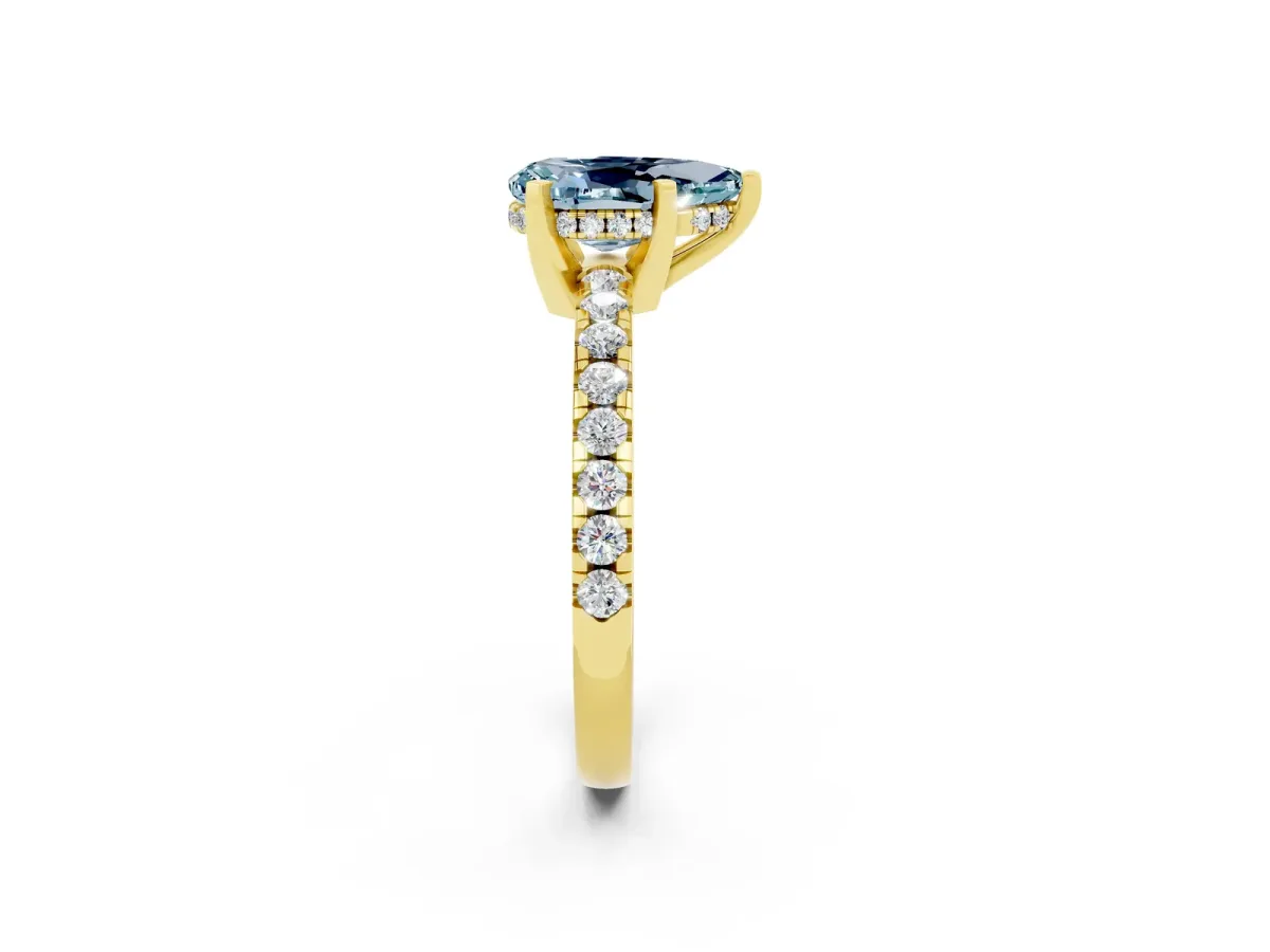 Pear Cut Aquamarine Solitaire Ring with Round Pavé Band and Four-Prong Setting Yellow gold