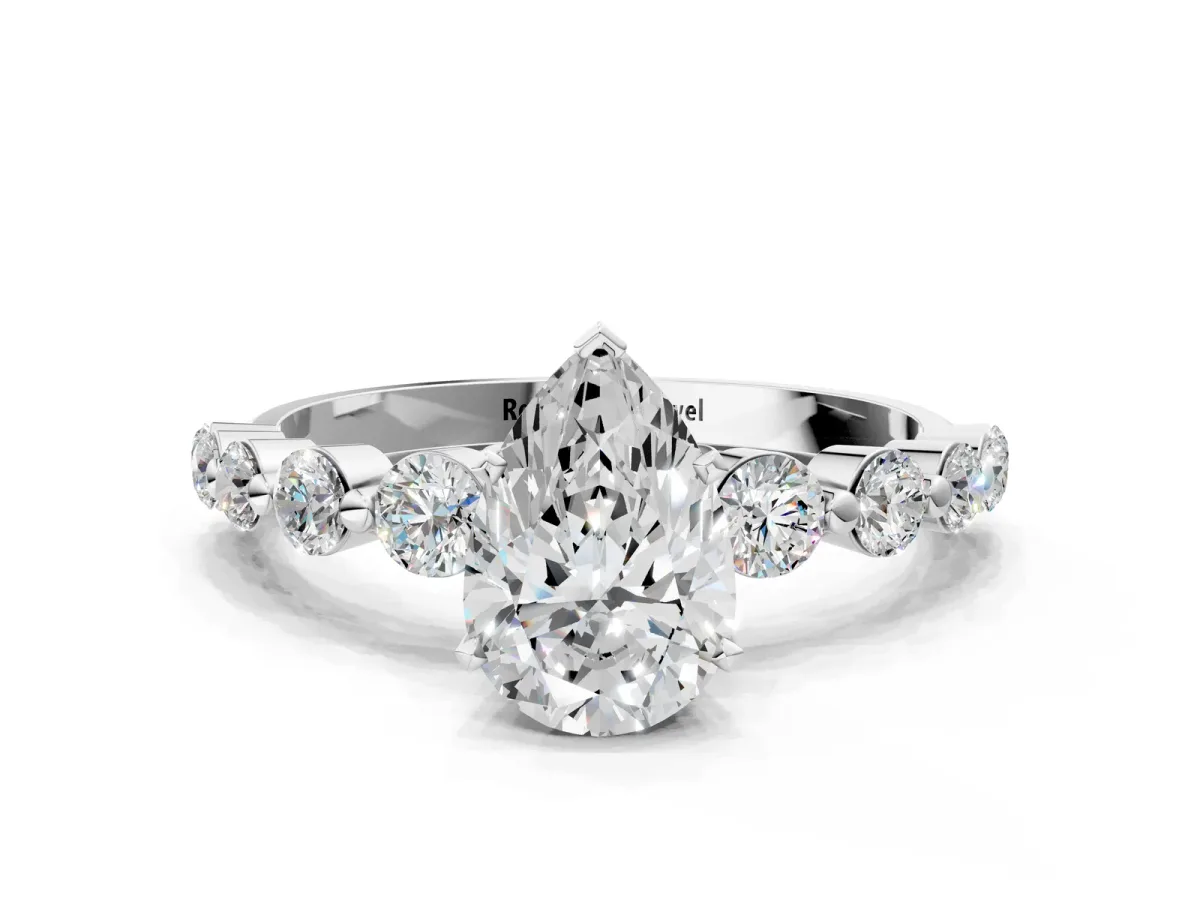 Pear Cut Solitaire Diamond Ring with Pave Band and Four-Prong Setting Silver