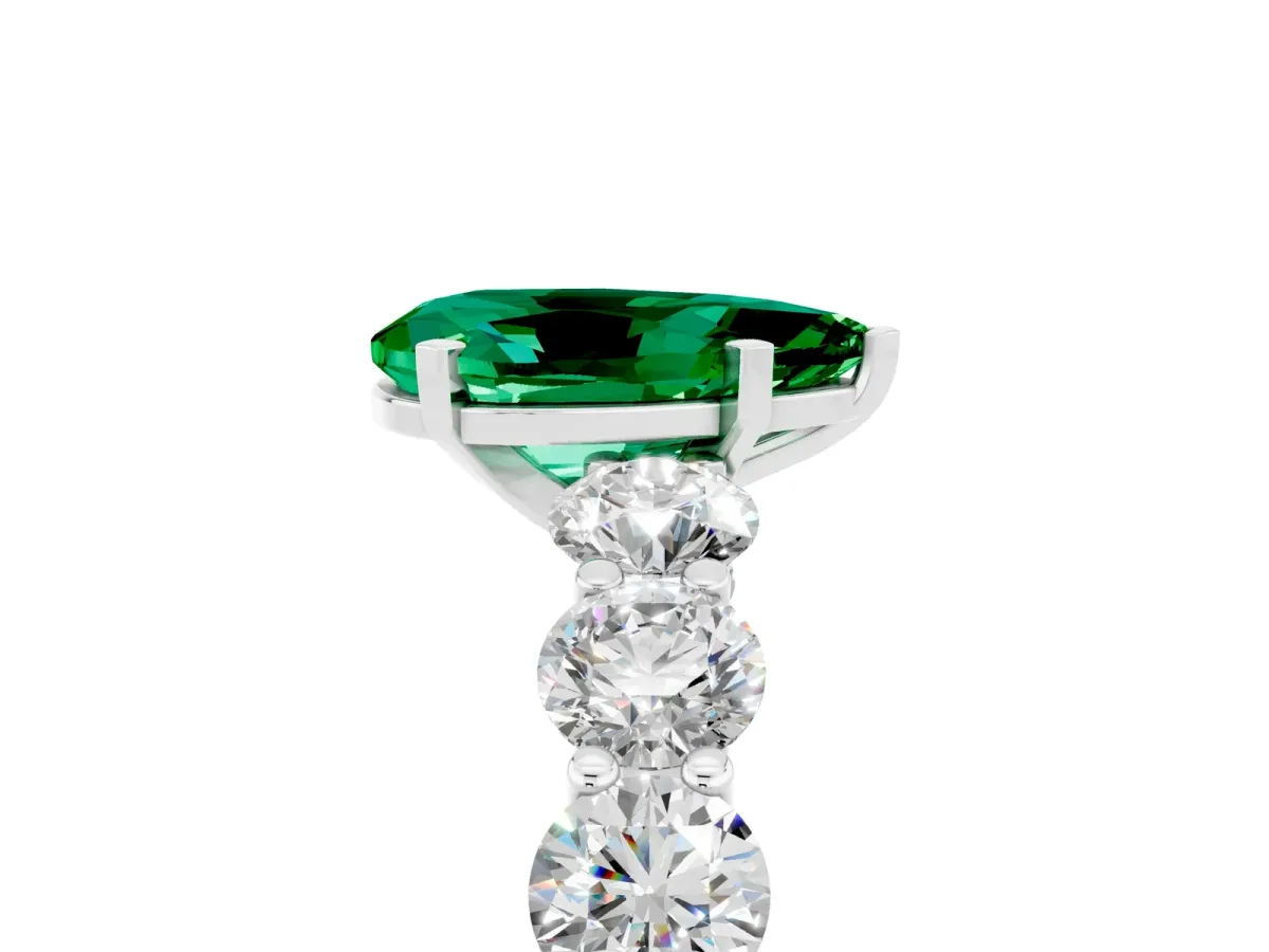 Pear Cut Emerald Prong Setting with Side Stones on a Pave Band Platinum