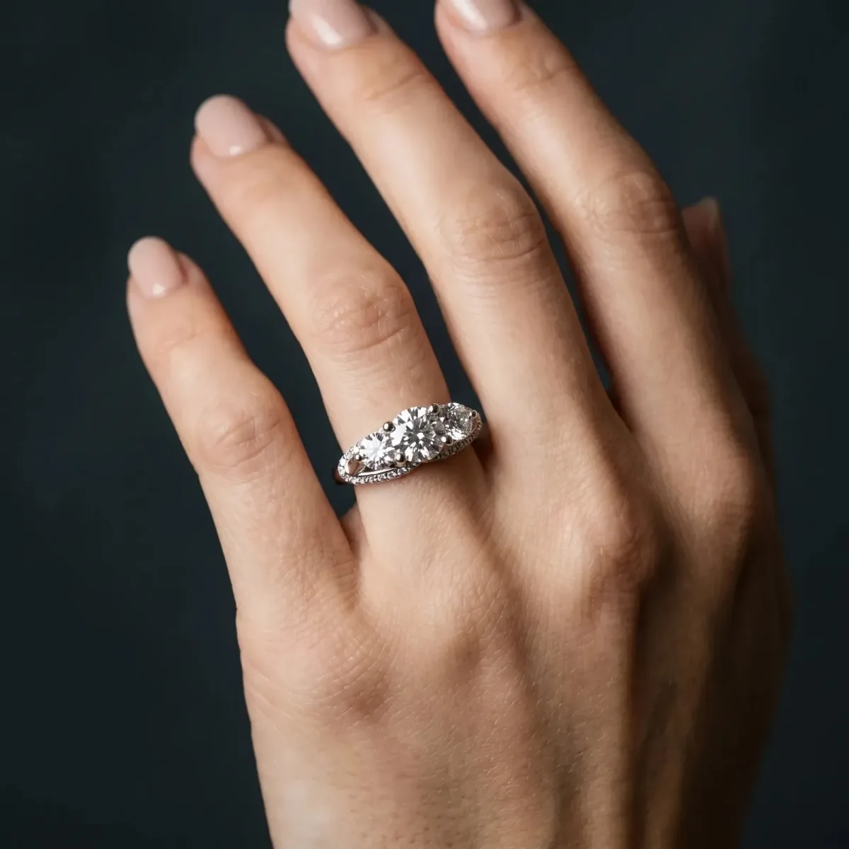 Round Cut Diamond Three-Stone Ring with Prong Setting and Pavé Band Silver