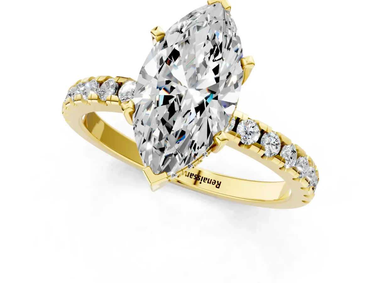 Marquise Cut Diamond Solitaire Ring with Round Pavé Band and Four-Prong Setting Yellow gold