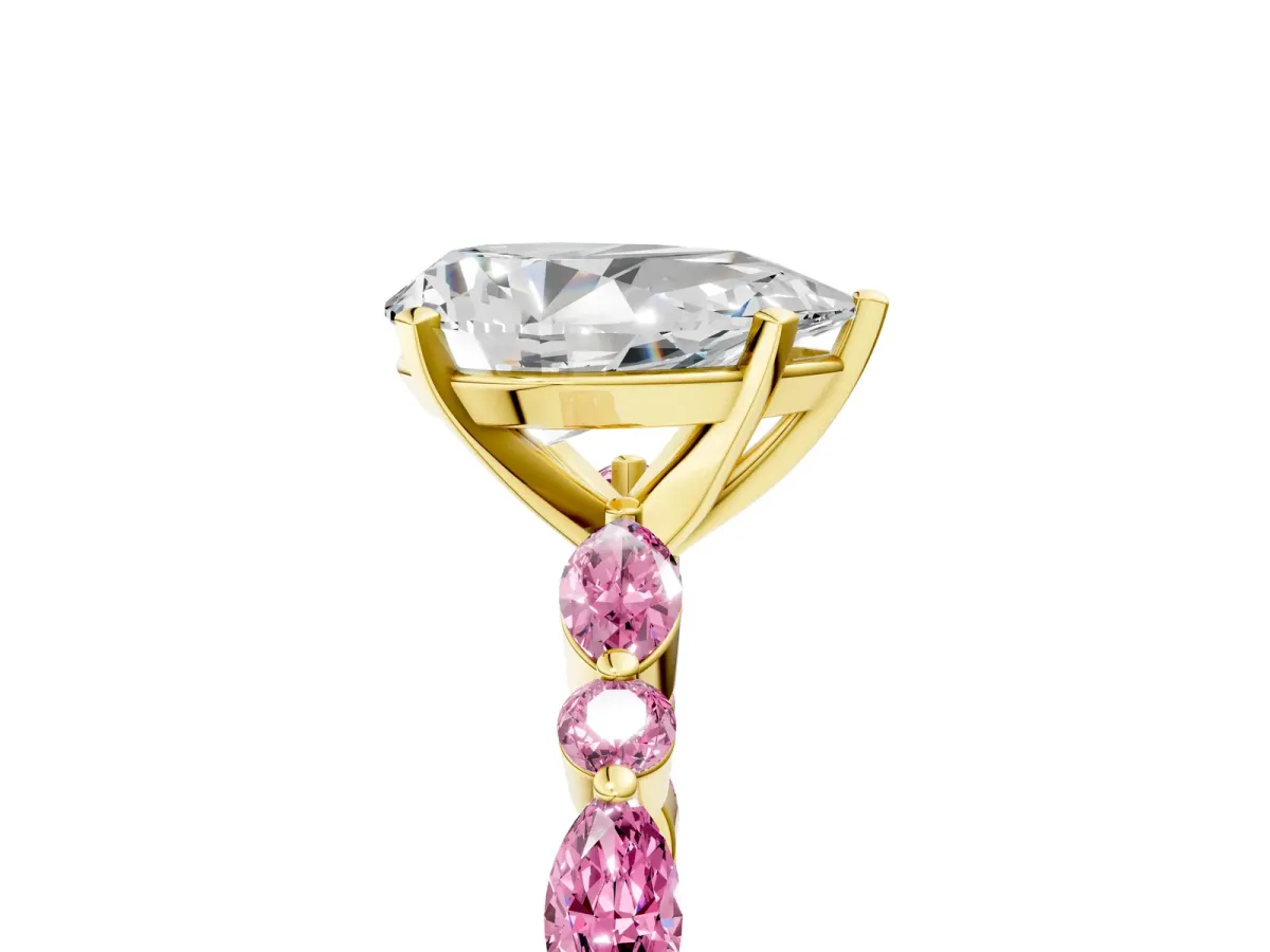 Pear Cut Diamond Ring with Marquise and Round Pink Sapphire Side Stones and Four-Prong Setting Yellow gold