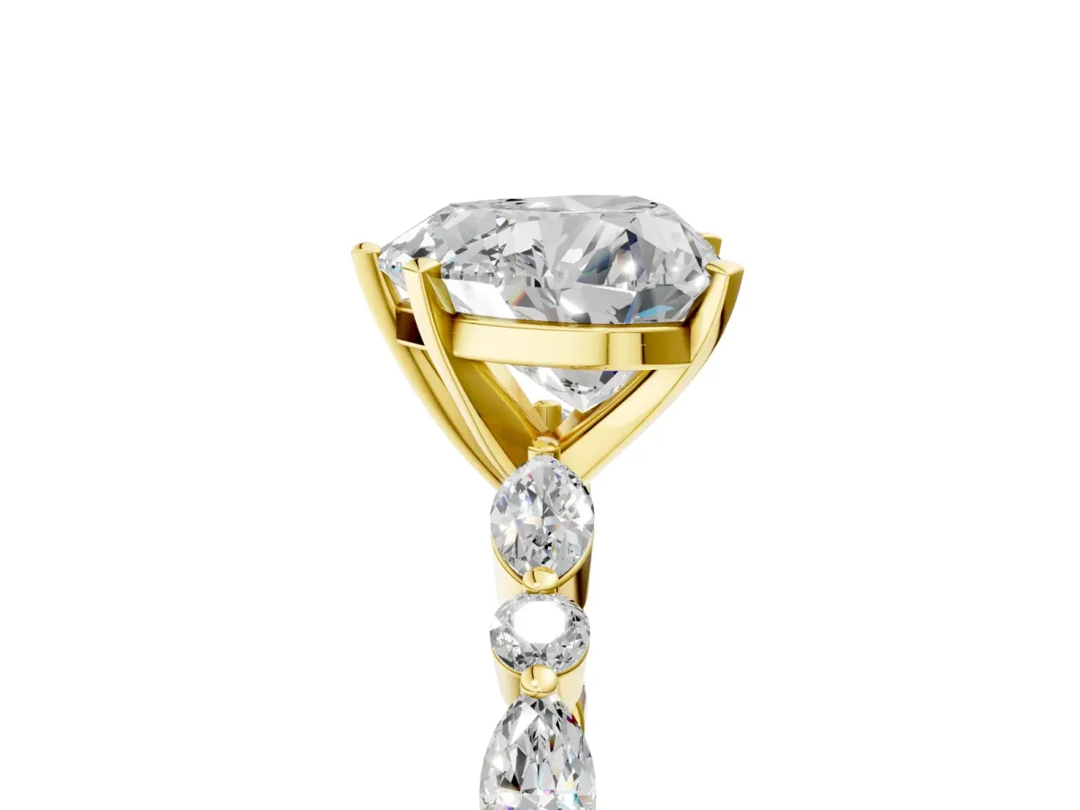 Heart Cut Diamond Ring with Marquise and Round Side Stones and Four-Prong Setting Yellow gold