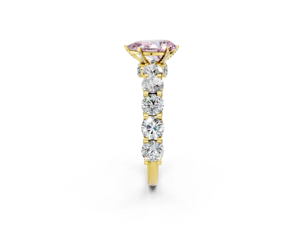 Fancy Pink Pear Cut Diamond Side Stone Engagement Ring with Four-Prong Setting Yellow gold