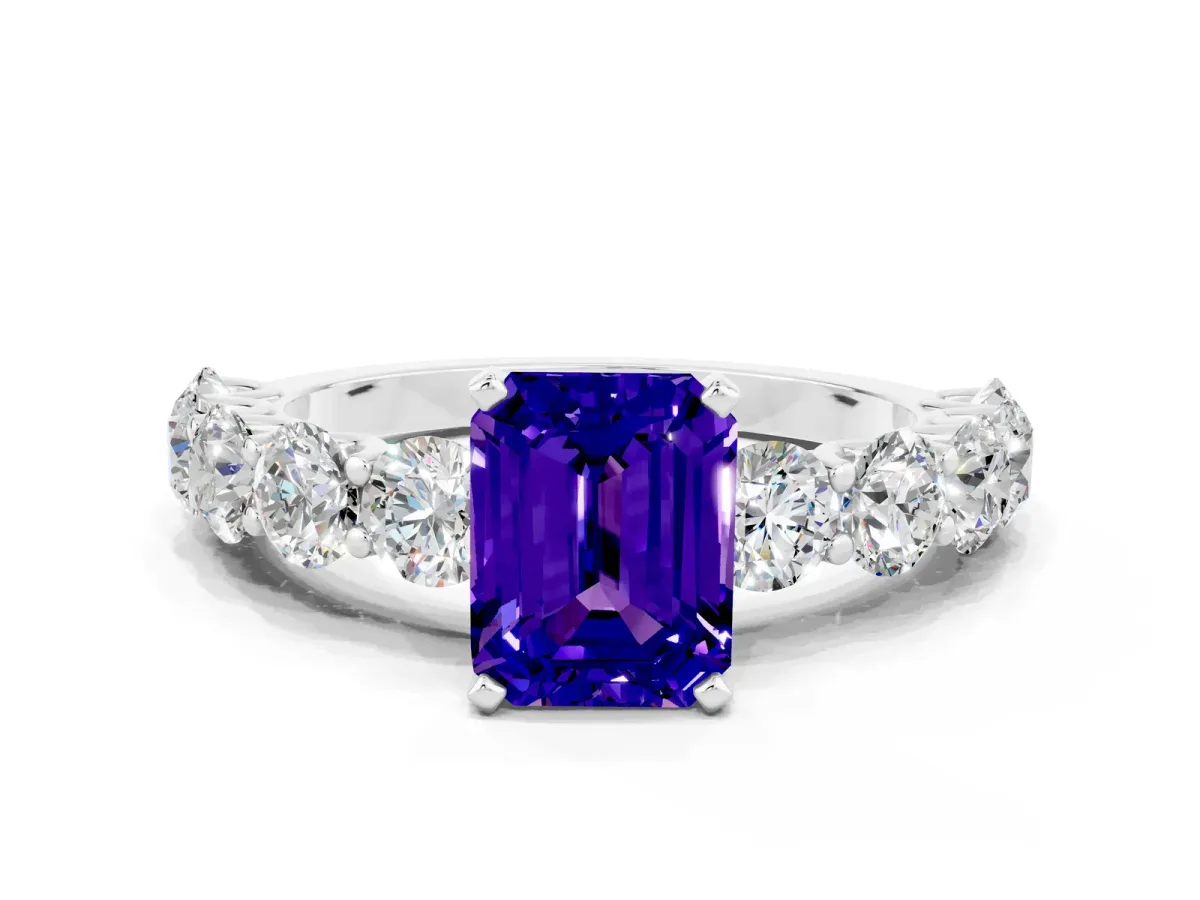 Emerald Cut Tanzanite Prong Setting with Side Stones on a Pave Band Silver