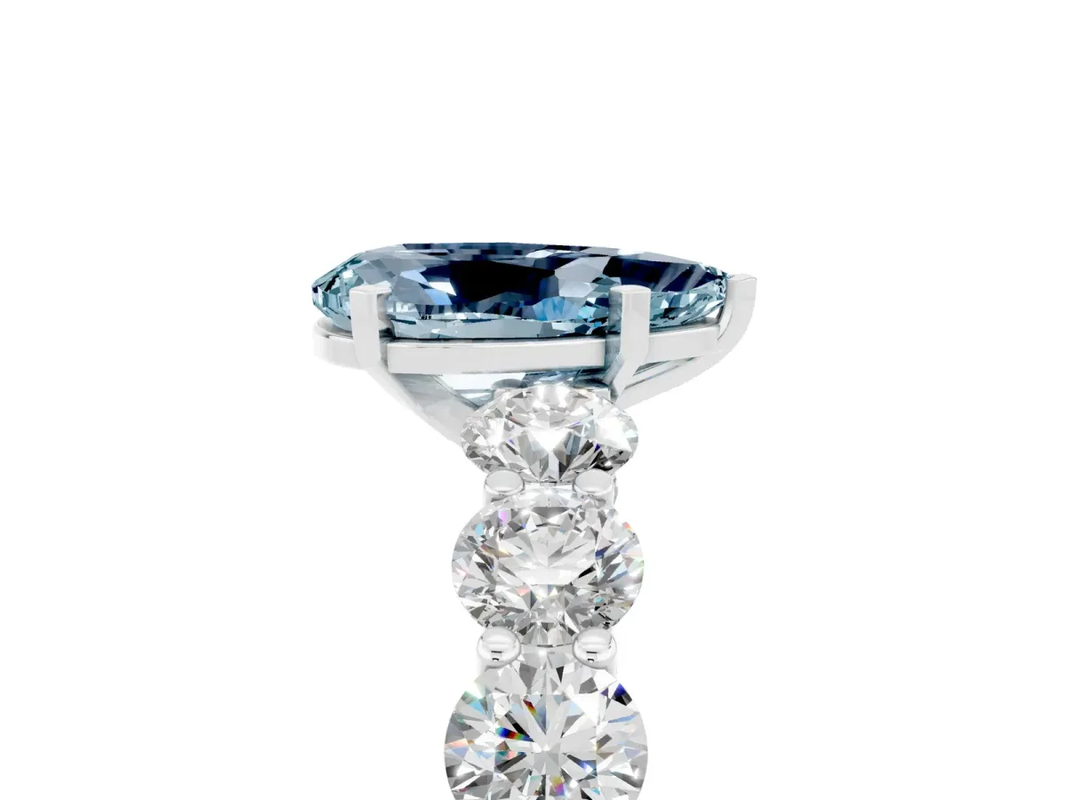Pear Cut Aquamarine Prong Setting with Side Stones on a Pave Band Silver