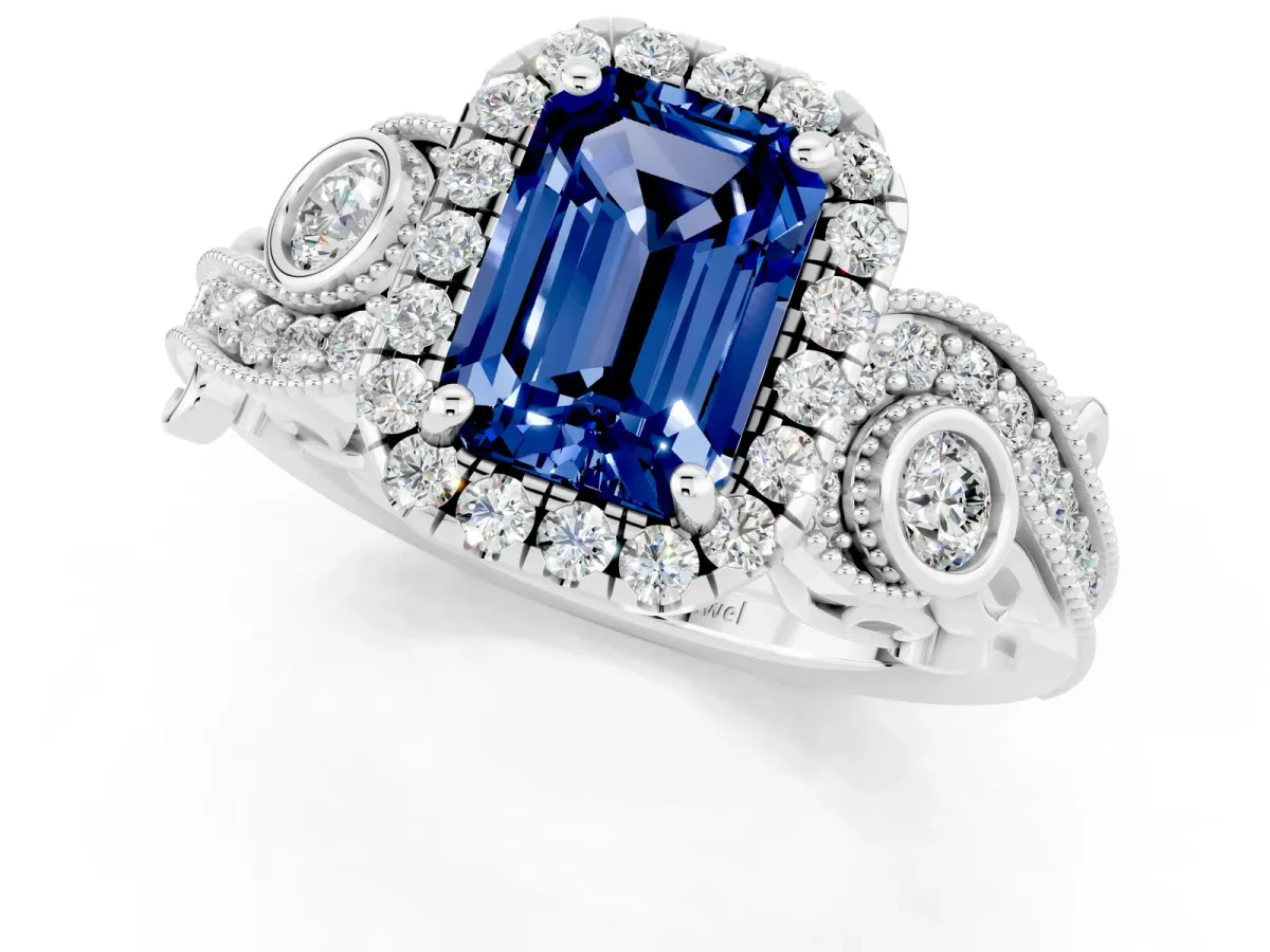 Emerald Cut Blue Sapphire Halo Ring with Milgrain Pavé Band and Four-Prong Setting White gold