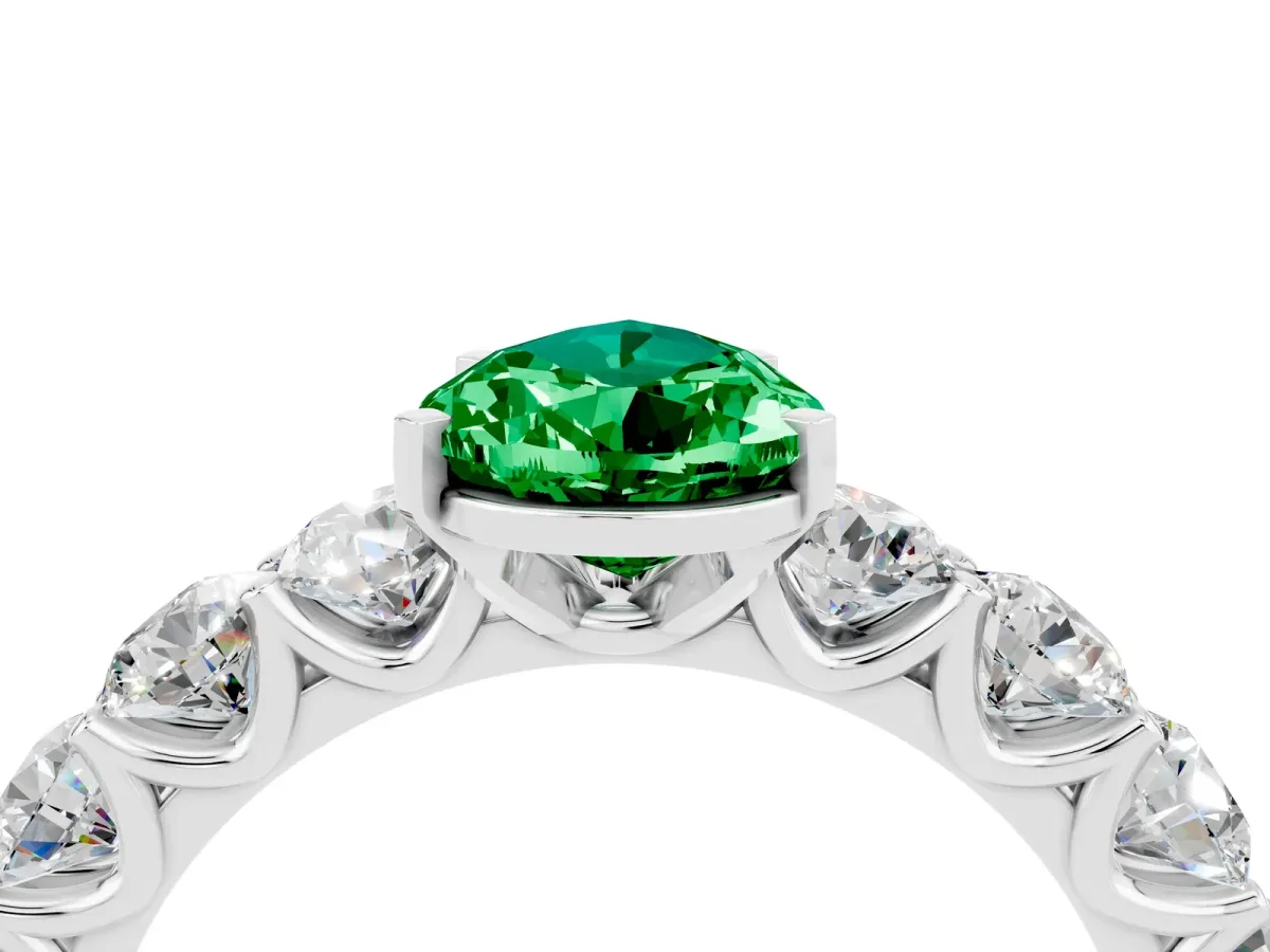 Pear Cut Emerald Prong Setting with Side Stones on a Pave Band Platinum