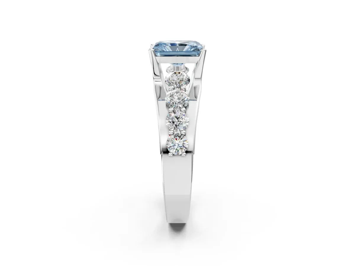 Fancy Blue Radiant Cut Brilliant Solitaire with Side Stones on a Pave Band and Four-Prong Setting Platinum