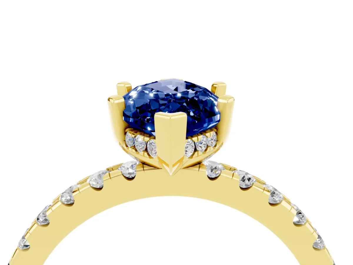 Marquise Cut Blue Sapphire Solitaire Ring with Round Pavé Band and Four-Prong Setting Yellow gold