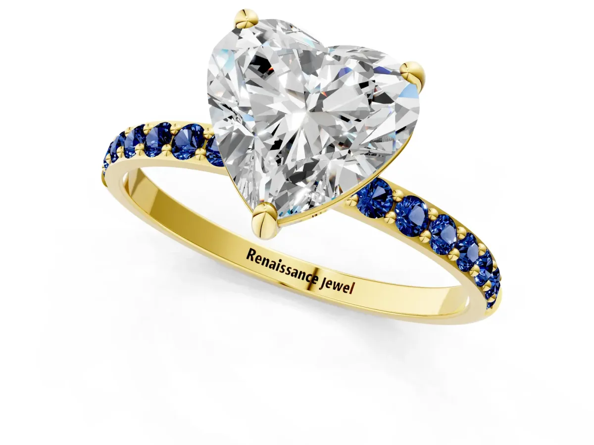 Heart Cut Diamond Solitaire Ring with Round Blue Sapphire Pavé Band and Prong Setting Yellow gold