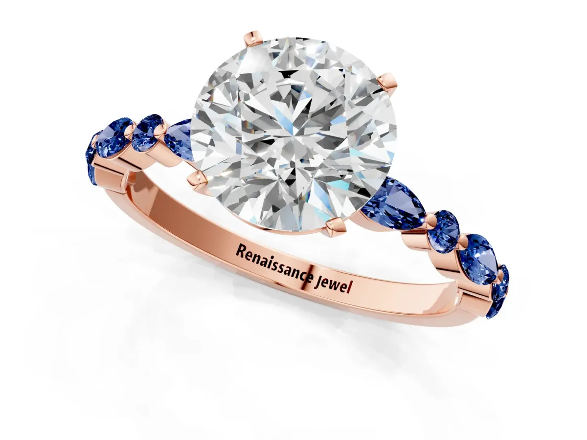 Round Cut Diamond Ring with Marquise and Round Blue Sapphire Side Stones and Four-Prong Setting Rose gold