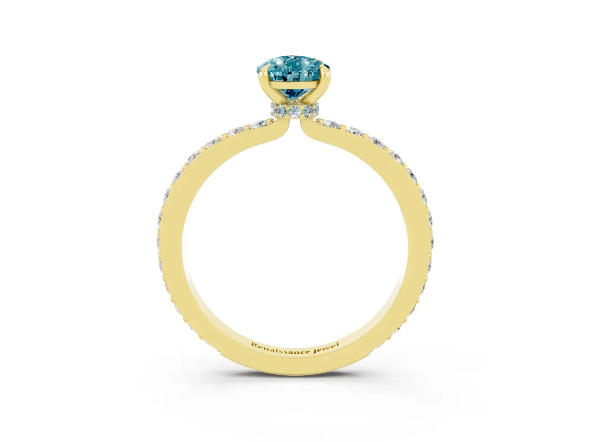 Pear Cut Blue Topaz Solitaire Engagement Ring with Pavé Band and Four-Prong Setting Yellow gold