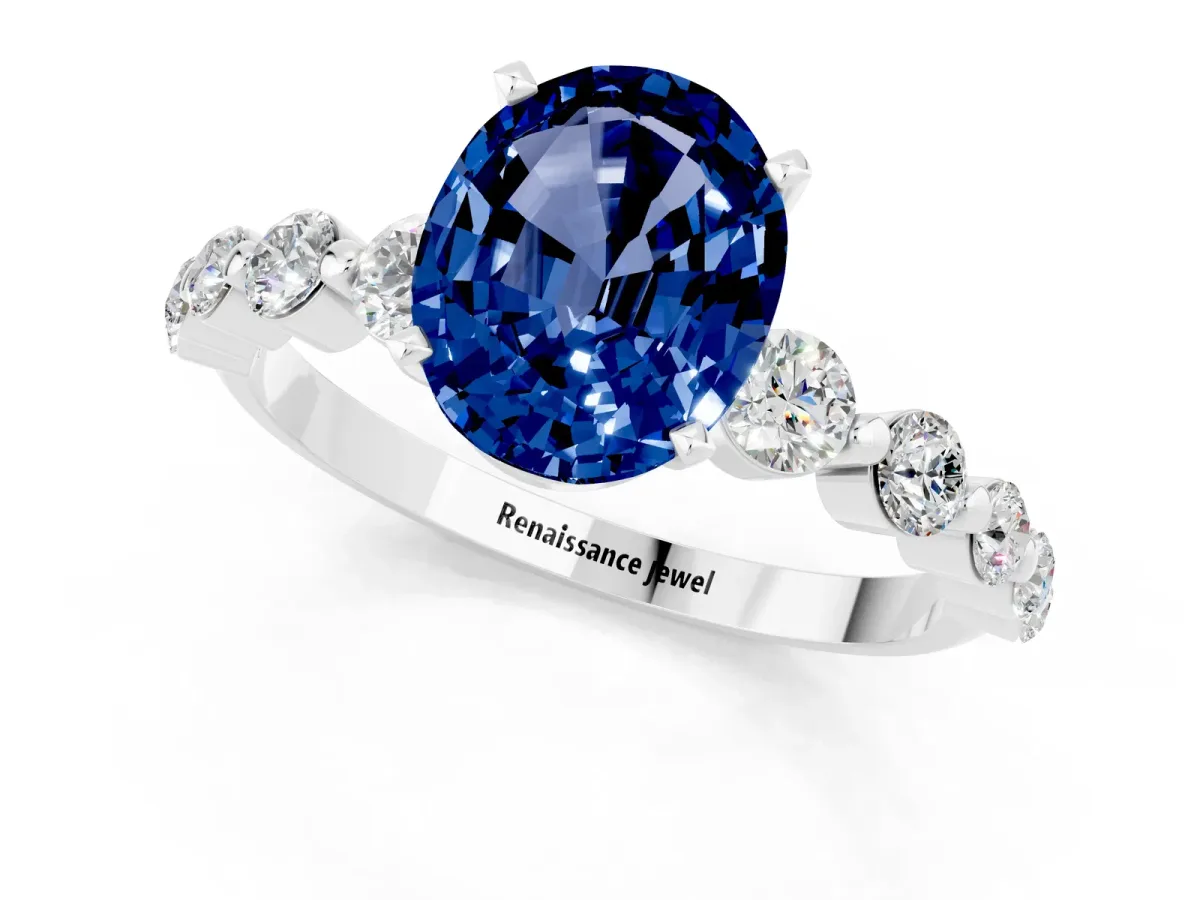 Oval Cut Solitaire Blue Sapphire Ring with Pave Band and Four-Prong Setting Platinum