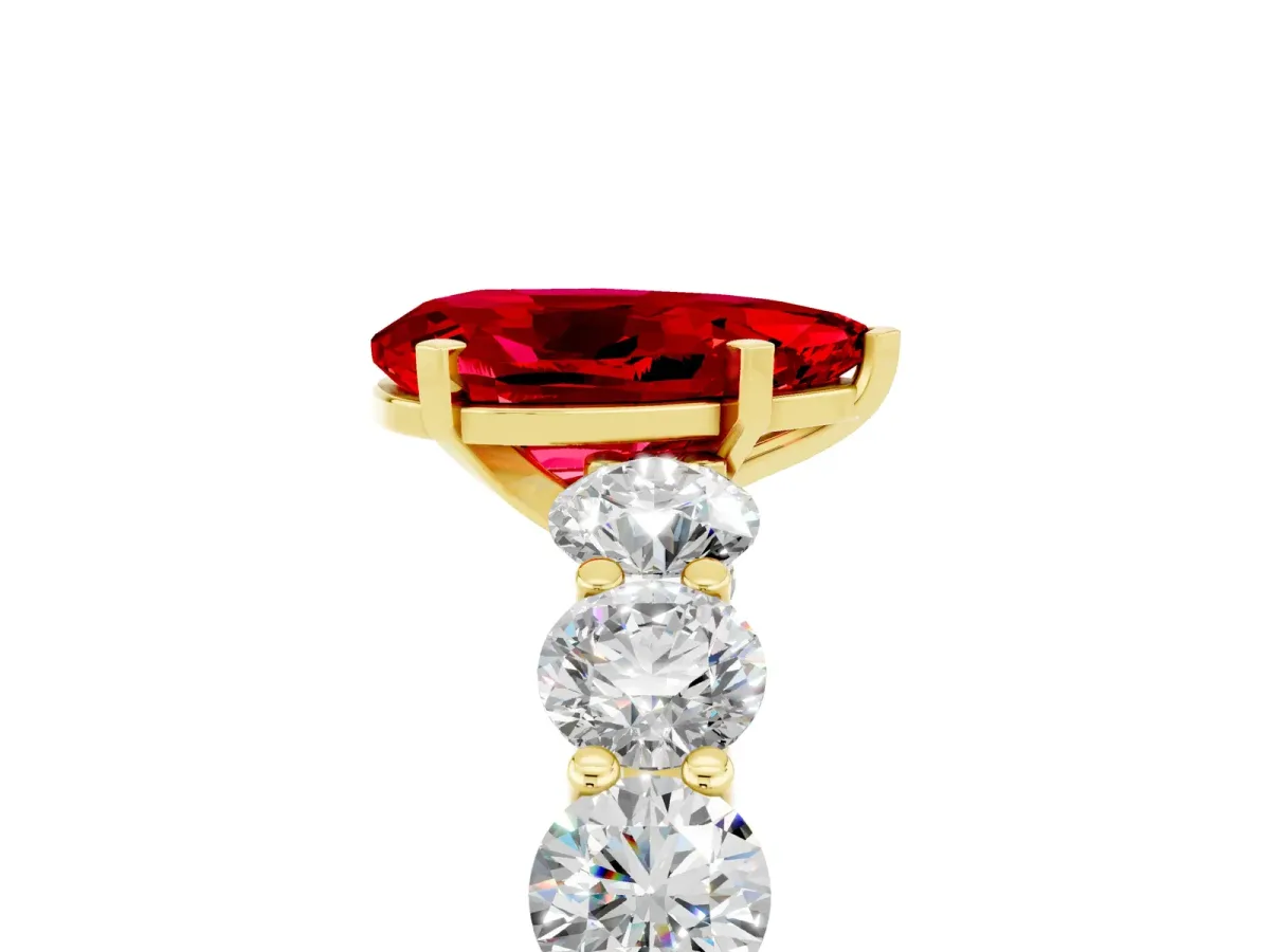 Pear Cut Ruby Prong Setting with Side Stones on a Pave Band Yellow gold