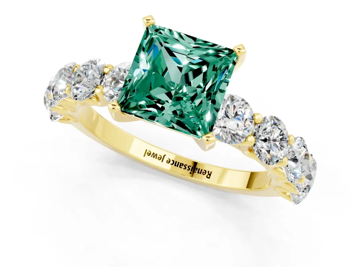 Princess Cut Green Sapphire Prong Setting with Side Stones on a Pave Band Yellow gold