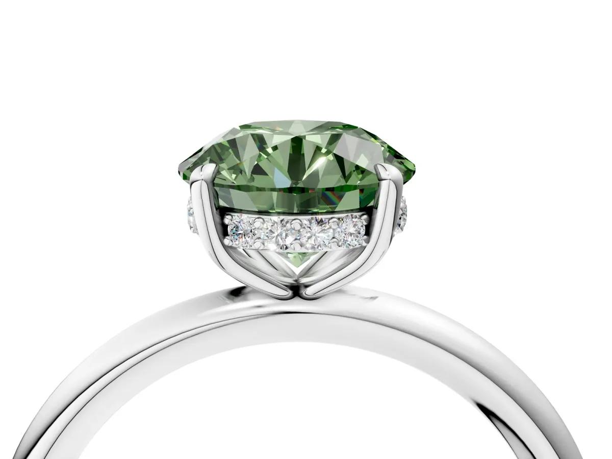 Fancy Green Round Cut Diamond Solitaire Ring with Thin Band and Four-Prong Setting Silver