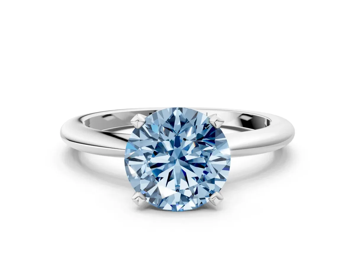 Fancy Blue Round Cut Diamond Solitaire Ring with Six-Prong Setting and Classic Band Platinum